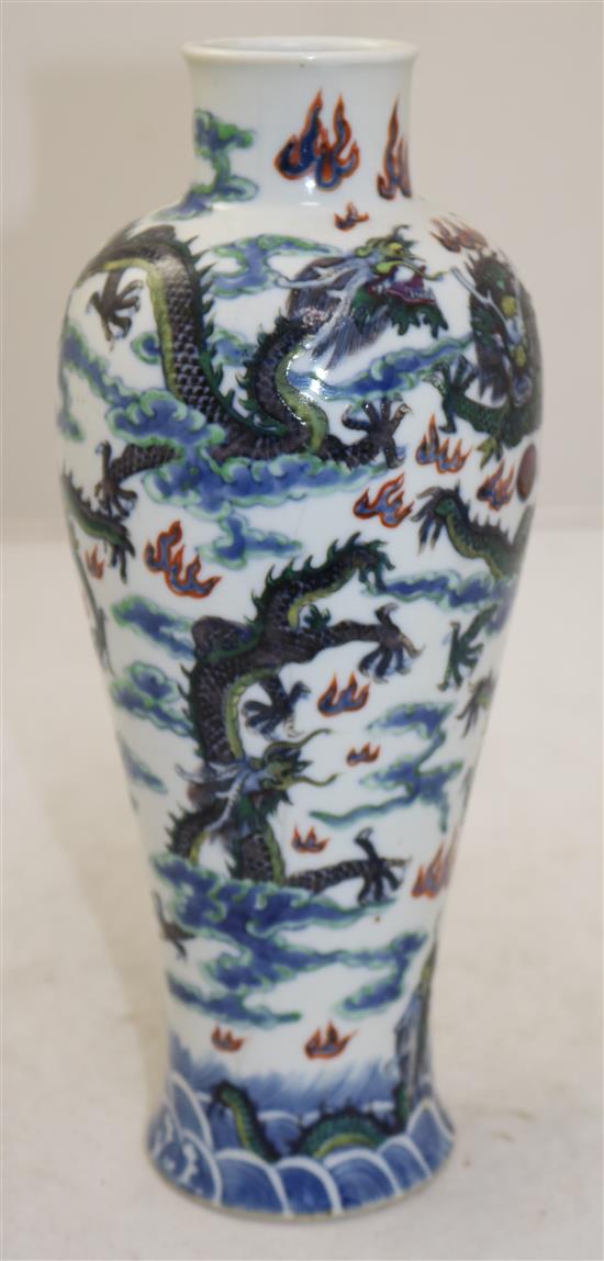 A Chinese clobbered blue and white meiping, 19th century, 26cm